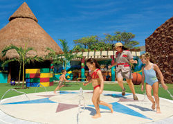 Kids splash in a fountain at the Explorer’s Club at Dreams Cancun. // (c) Dreams Resorts & Spas