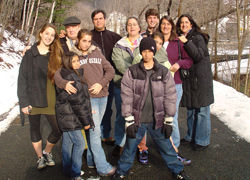 The extended Maisterra family enjoys a walk through the woods