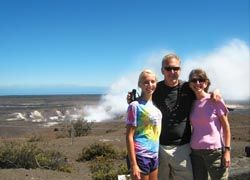 With her husband and daughter in front of steaming Halemaumau Crater, Hawaii Volcanoes National Park. // © 2010 Marty Wentzel; istockphotos; photos.com