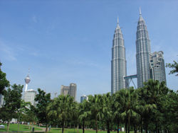The soaring steel-and-glass towers of Kuala Lumpur offer a contrast to Malaysia’s idyllic beaches. // (c) Peter Macdonald