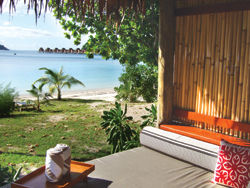Guests can stay in land-based or overwater bungalows. // (c) Monica Poling Guests can stay in land-based or overwater bungalows. // (c) Monica Poling