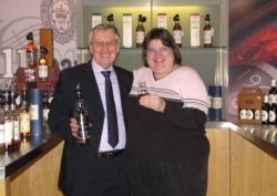 The writer samples John Black Whisky with the scotch blend's namesake. // (c) 2009 Monica Poling