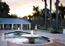Fern Tree Spa at sunset Right: A client gets a full body treatment. // © Half Moon