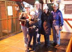 The writer suited up with traveling companions to explore the underground tunnels. // © 2010 Deborah Dimond