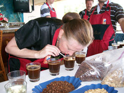 Woman sniffing coffee at a cupping competition during Kona Coffee Cultural Festival. // (c) Kona Coffee Cultural Festival