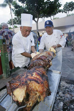 Two chefs with slab of meat at Taste of the Hawaiian Range, Hawaii's Big Island. // (c) Michael Darden, West Hawaii Today