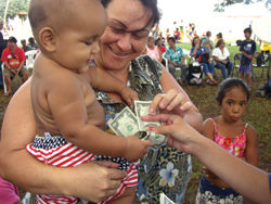 At the Once-A-Month Church, people don’t give an offering, they get one — $2 for each person. // (c) Joe Brown