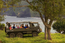 Guests on a six-wheel drive vehicle during the Kohala Wai PinzTrek adventure on the Big Island. // (c) Hawaii Forest & Trail