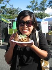 Rebecca covets a delicious kalua pork slider. // © Deanna Ting 2010