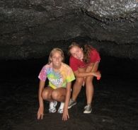 Two girls in Thurston Lava Tube, Hawaii Volcanoes National Park, Hawaii's Big Island. // © 2010 Marty Wentzel