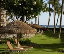 Oceanfront lawn chairs under thatched umbrella, Kaanapali Alii, Maui. // © 2011 Classic Resorts Oceanfront lawn chairs under thatched umbrella, Kaanapali Alii, Maui. // © 2011 Classic Resorts