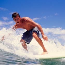 The Hawaiian Islands are known for surfing, and Poipu Beach in Kauai is the perfect place to learn to hang 10. // © 2013 Thinkstock The Hawaiian Islands are known for surfing, and Poipu Beach in Kauai is the perfect place to learn to hang 10. // © 2013 Thinkstock