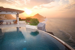 A rendering of Capella Pedregal depicts a sunset over one of the resort’s infinity pools. // (c) Capella Hotels & Resorts