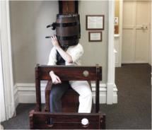 A Kingston Penitentiary museum docent in period garb, demonstrates the use of the ‘drowning’ water torture device // © 2010 Pride Travel / S. Nathan DePetris A Kingston Penitentiary museum docent in period garb, demonstrates the use of the ‘drowning’ water torture device // © 2010 Pride Travel / S. Nathan DePetris