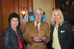 Famed oceanographer and celebrity lecturer for Regent Seven Seas Cruises, Jean-Michel Cousteau (center), signs autographs for Margret Propper (left), Brownell Travel, Ala., and Susan Walsh (right), Br