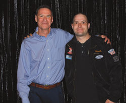 Gerry Cahill, president and CEO of Carnival Cruise Lines (left), with winner Cameron Regan of Boulevard Travel