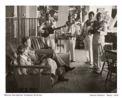 Amelia Earhart and her husband George Putman relax at The Royal Hawaiian during a visit to Waikiki in 1934. // (c) Matson Navigation Co. Archives