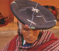 Clad in traditional clothing she wove herself, a Chinchero weaver focuses intently on a new design. At over 12,000 feet high, Chinchero has a long history of Peruvian textile craftsmanship. // (c) Nathan DePetris
