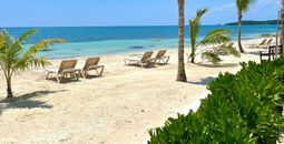 Spaced out beach chairs in Jamaica