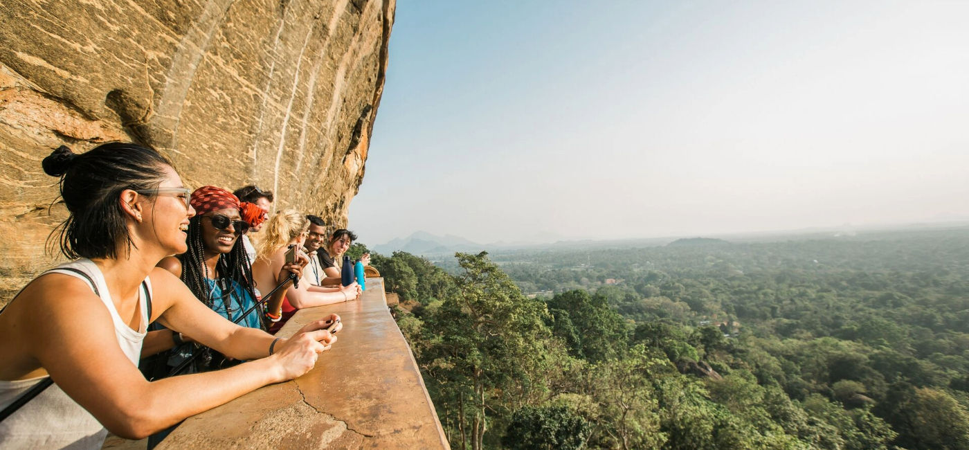 Image: Travelers take in the views of Sigiriya, Lion Rock Fortress in Sri Lanka. (Photo Credit: Intrepid Travel)