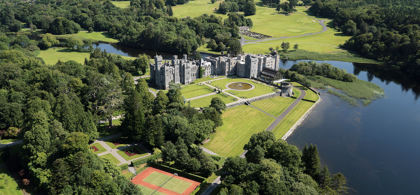 Image: Aerial view of historic Ashford Castle, now a luxury hotel. (Photo Credit: Red Carnation Hotels)