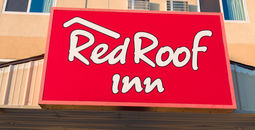 Red Roof Inn exterior sign.