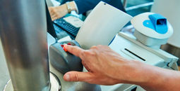 Passenger using biometric technology at the airport.