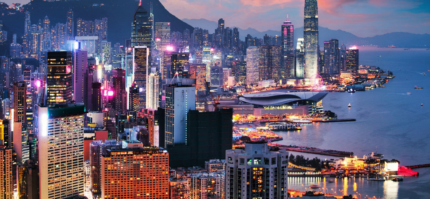 Image: View of Hong Kong at sunset. (Photo Credit: TTstudio/Adobe)