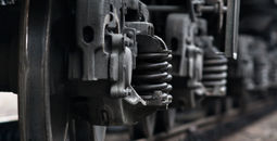 Train wheels on rails.