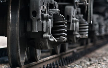Train wheels on rails.