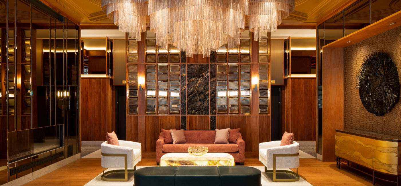 Image: A seating area inside the lobby of the HONEYROSE Hotel. (Photo Credit: HONEYROSE Hotel)
