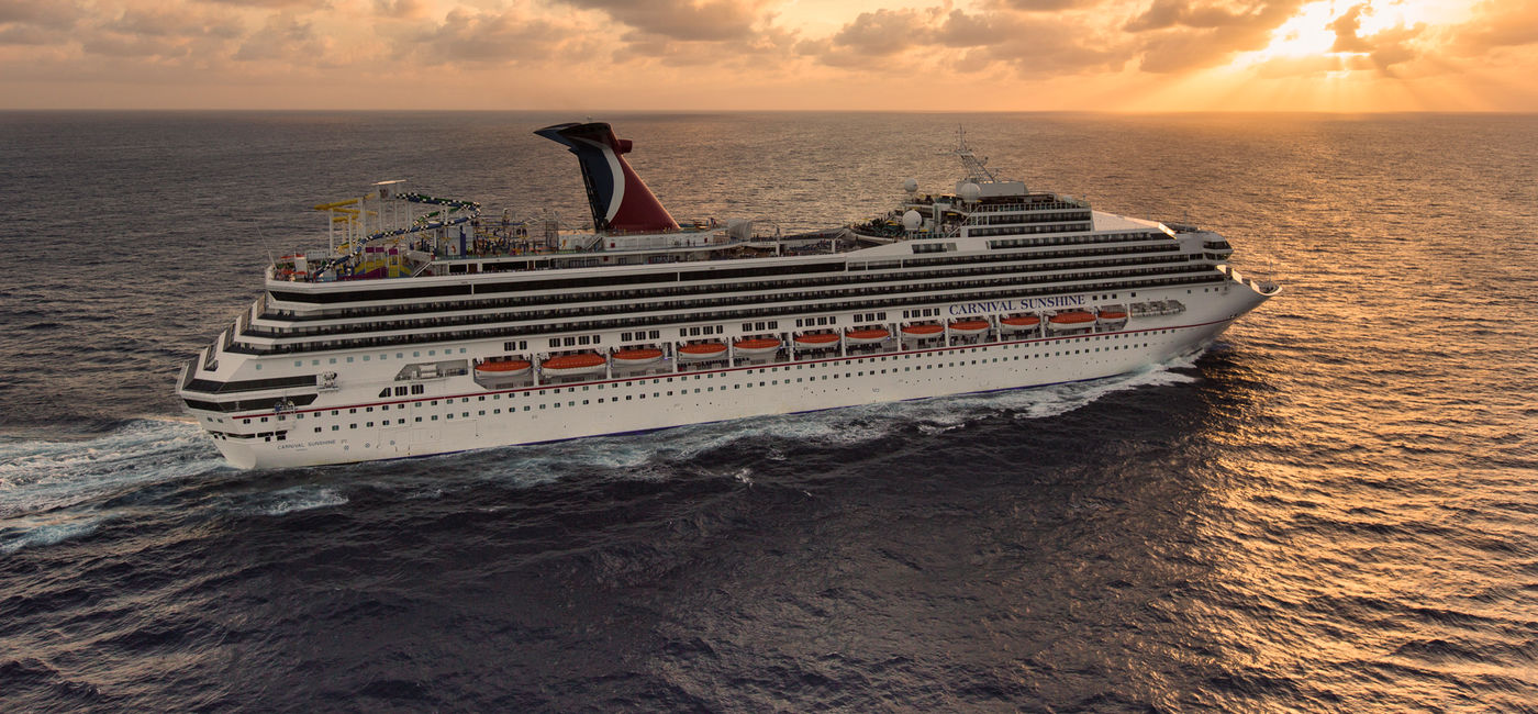 Image: The Carnival Sunshine cruise ship sails toward the sunset. (photo via Carnival Cruise Line)