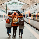 A group of young friends waiting at the station in Porto, Portugal before catching a train.