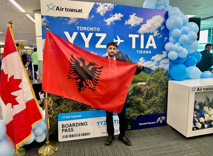 Flag of Albania held by Air Transat Staff Flag of Albania held by Air Transat Staff