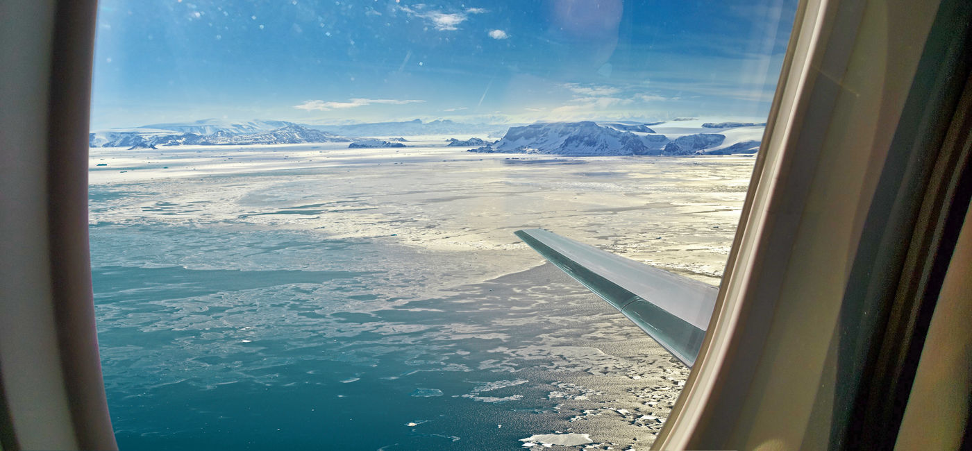 Image: The view of Antarctica from an airplane window. (Photo Credit: Atlas Ocean Voyages)