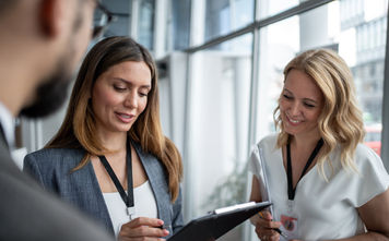 Business people working together at a conference.