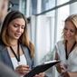 Business people working together at a conference.