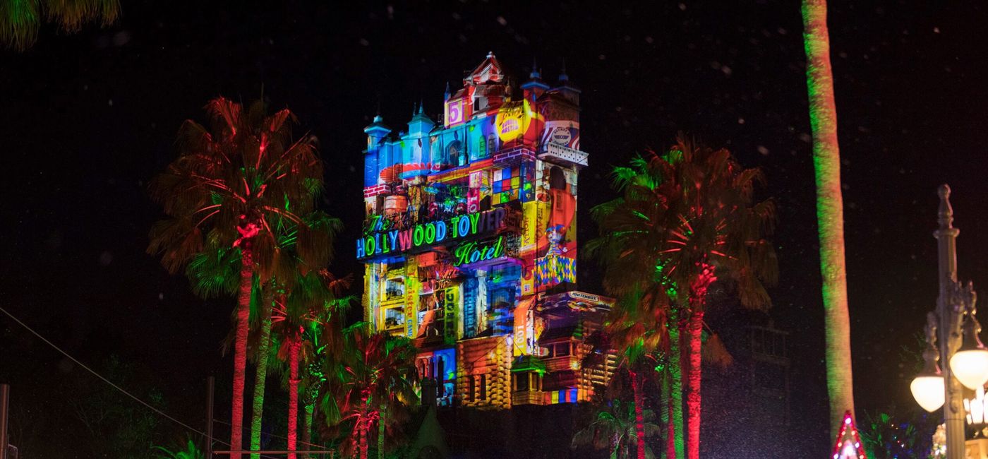 Image: The Hollywood Holiday Tower Hotel alight with holiday projections at Walt Disney World Resort, Orlando, Florida. (Photo via Disney)
