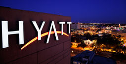 Hyatt hotel marquee above San Antonio, Texas. 