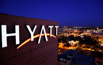 Hyatt hotel marquee above San Antonio, Texas. 