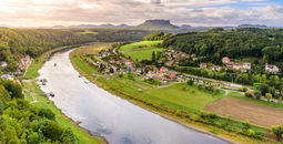 View from the bastei viewpoint of the Elbe river and the Rathen town in beautiful landscape scenery, Sandstone mountains, Saxon Switzerland National Park, Germany