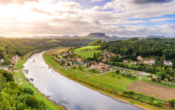 View from the bastei viewpoint of the Elbe river and the Rathen town in beautiful landscape scenery, Sandstone mountains, Saxon Switzerland National Park, Germany