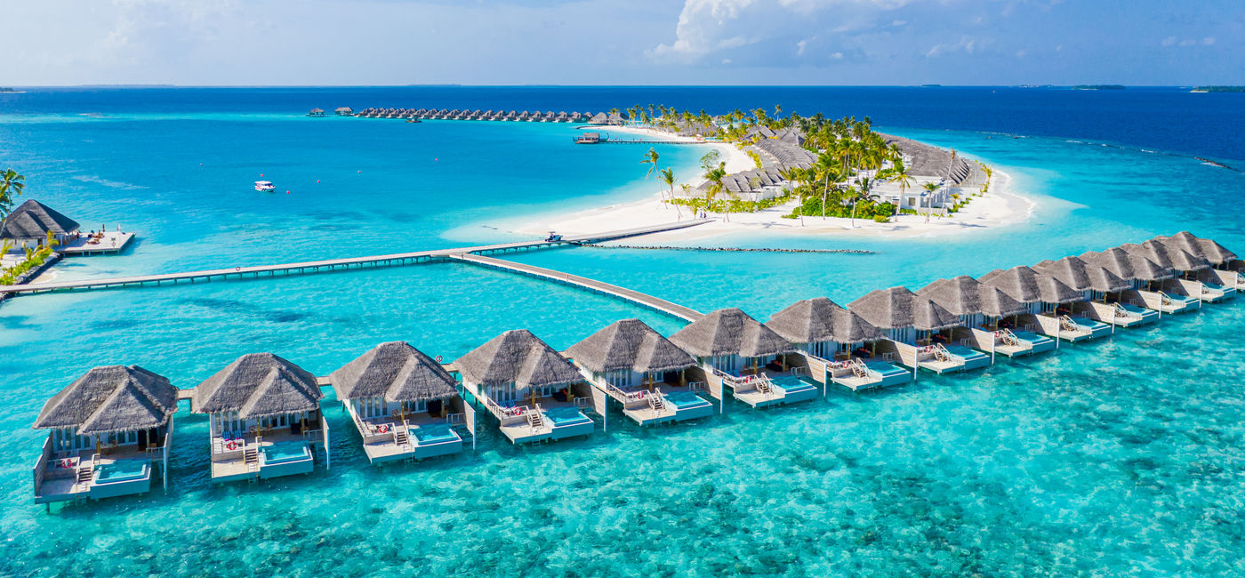 Image: An island resort in The Maldives. (Photo Credit: Adobe Stock/icemanphotos)