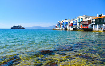 PONANT&#39;s Le Bougainville sailing the waters off the Greek island of Mykonos.