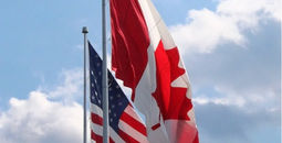 US and Canadian flags drooping