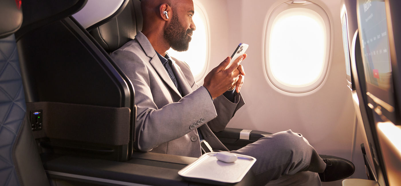 Image: Traveler flying first class on Delta (Photo Credit: Delta Air Lines)
