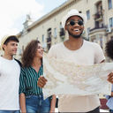 Travelers using a map to explore a city