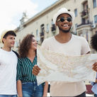 Travelers using a map to explore a city