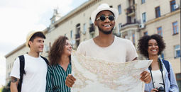 Travelers using a map to explore a city