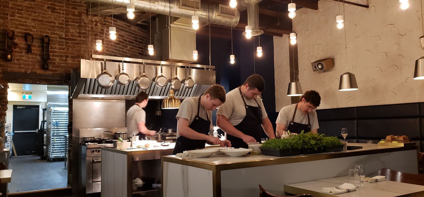 Image: The open kitchen at ARVI invites diners to be part of the experience (Photo Credit: Jen Mallia)